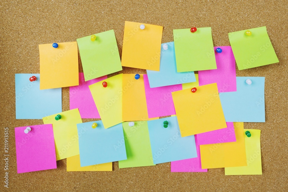 collection of colorful variety post it. paper note reminder sticky notes  pin on cork bulletin board. empty space for text. Stock Photo
