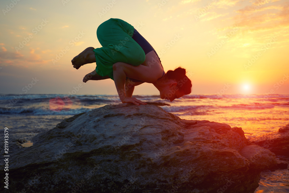 Woman silhouette on sunset sky background young active girl sit in yoga ...