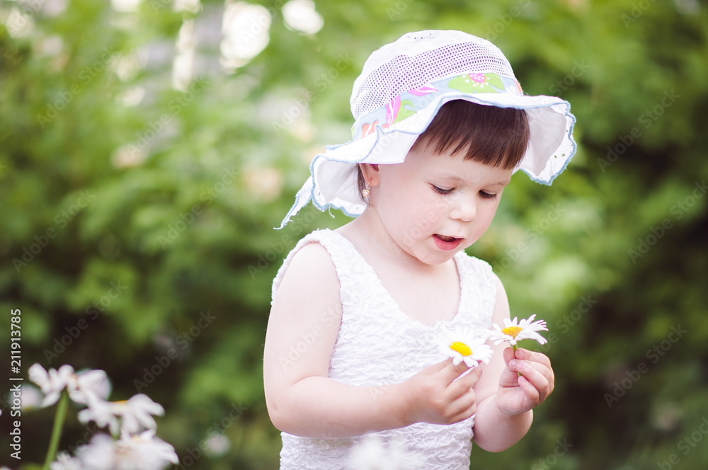 happy little girl playing on nature sitting on tree happy little girl playing on nature sitting on tree