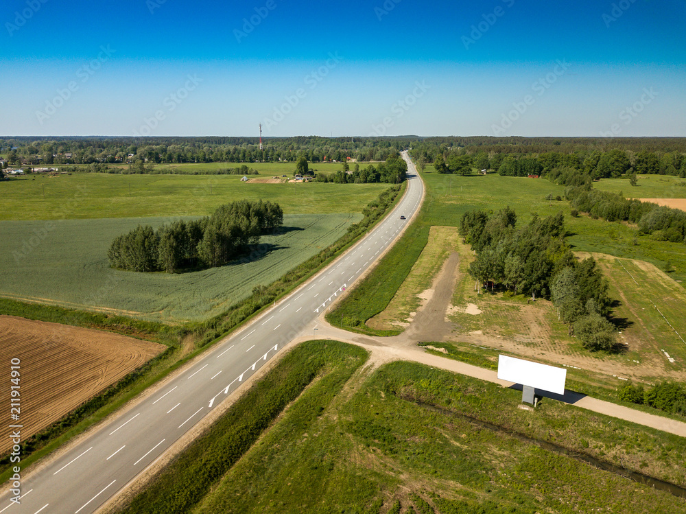 Road from above and white billboard. Aerial view. Drone. 