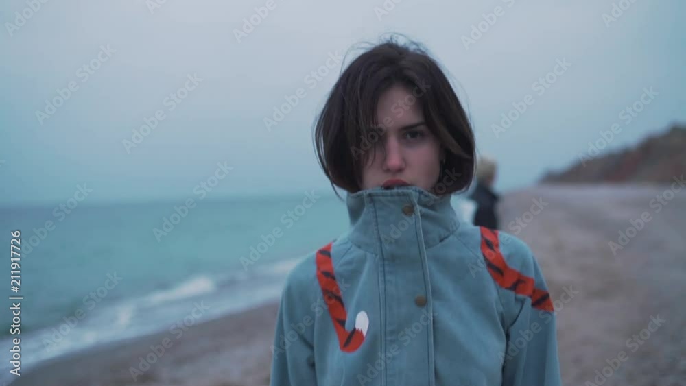 Fashionable girl walks on the beach. Fashionable girl walks on the beach.
