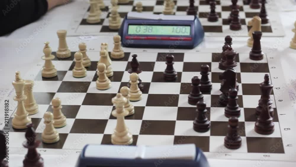 The hand of a man playing chess The hand of a man playing chess