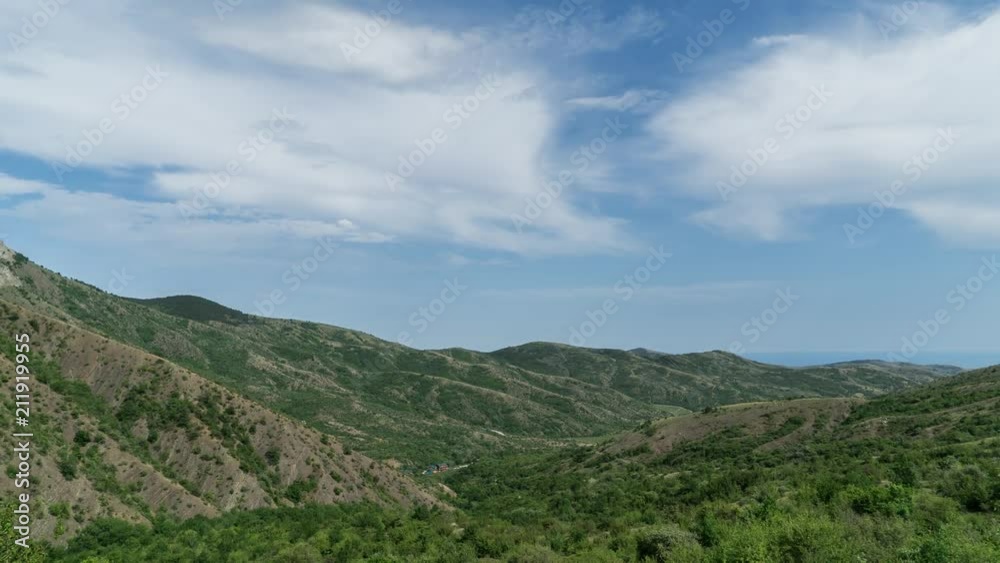 Mountain valley, view of the mountains and hills, cloudy sky, timelapse.
Mountain valley, view of the mountains and hills, cloudy sky, timelapse.