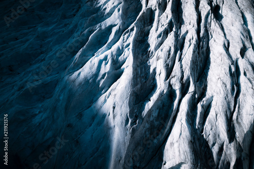 Aerial view of glacier crevasses photo