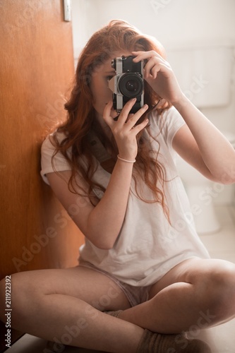 Woman clicking photo with camera photo