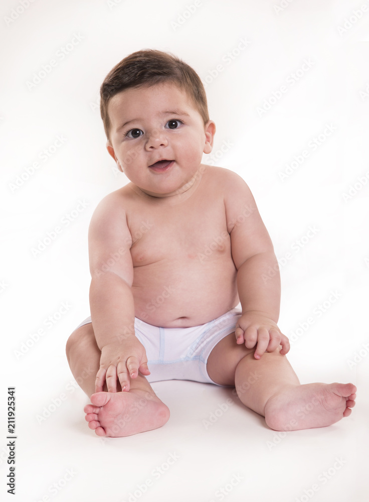 Little baby boy sitting and looking at camera. Brazilian baby. Little baby boy sitting and looking at camera. Brazilian baby.