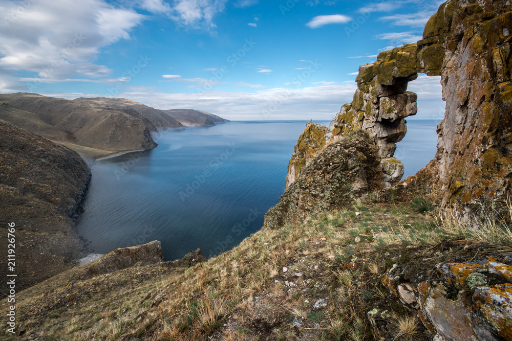 Beautiful view of the stone arch on the shore of Lake Baikal Beautiful view of the stone arch on the shore of Lake Baikal