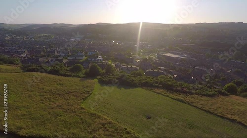 Aerial reveal of a Scottish town at sunset or sunrise photo