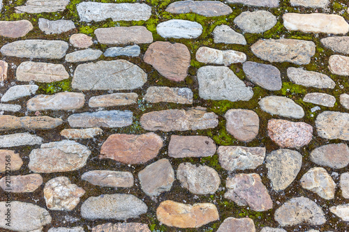 Cobble Stone bricks floor with pattern and dirt medival construction photo