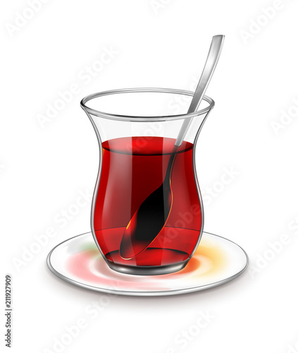 Turkish tea cup with black tea and silver spoon