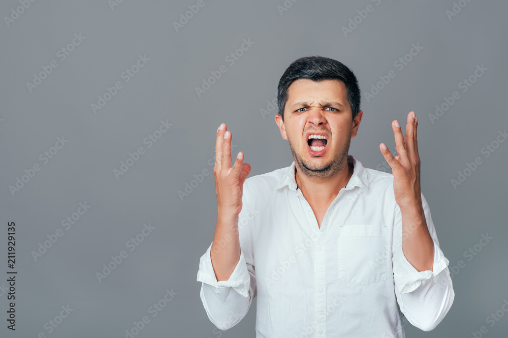 Portrait of stressful frustrated man has panic screams and gestures in terror, shocked to hear bad new. Disappointed male, disbelief, facial expression. People Business Work Emotions Office