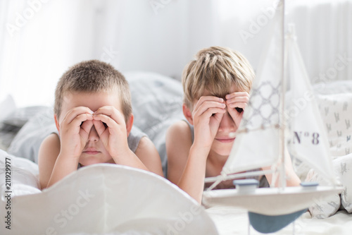 Brothers - a lazy morning in bed, bedding. Fun and rest, relax, lazy Sunday photo