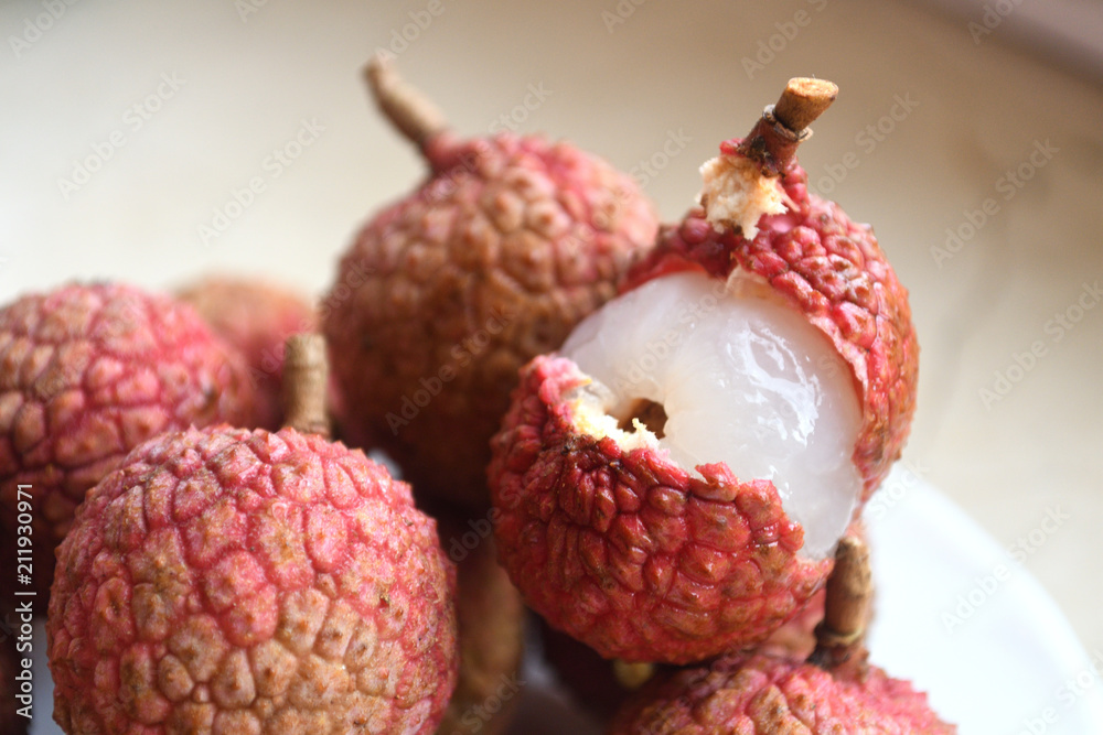 Fresh and juicy lychees on neutral background. Fresh and juicy lychees on neutral background.