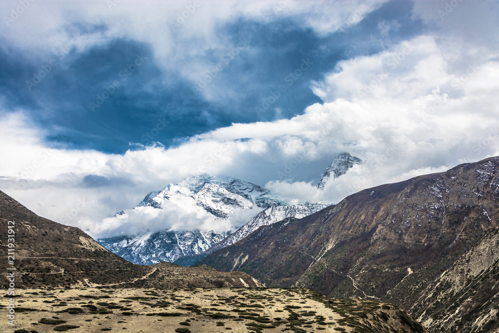 Mountain peaks in snow and clouds, Nepal.