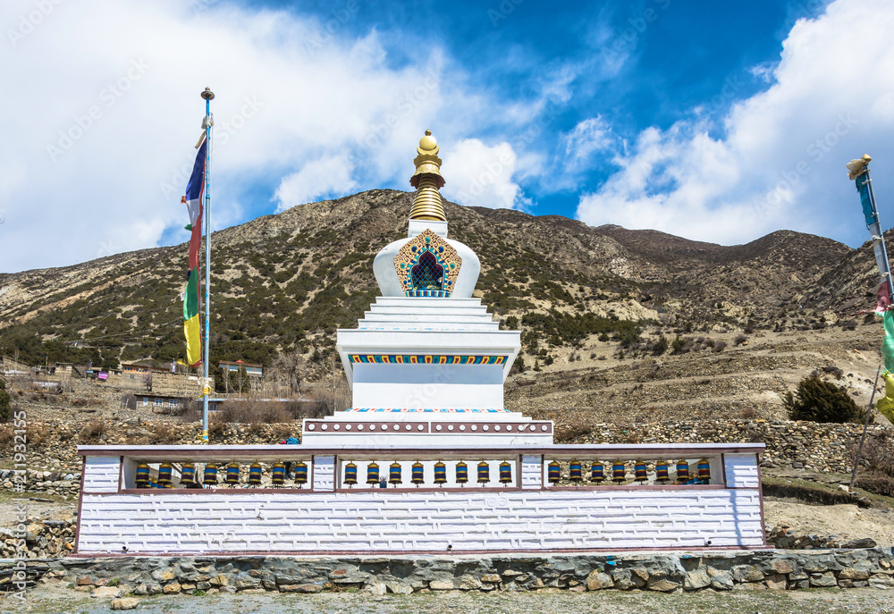 Stone Buddhist stupa in a mountain village in the Himalayas, Nepal.