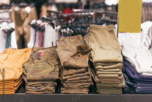 Men's pants on store shelves photo