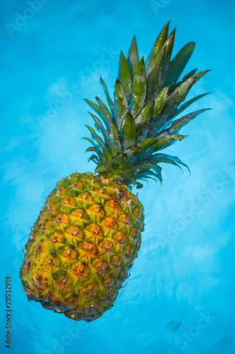 Pineapple in the pool, holiday feeling