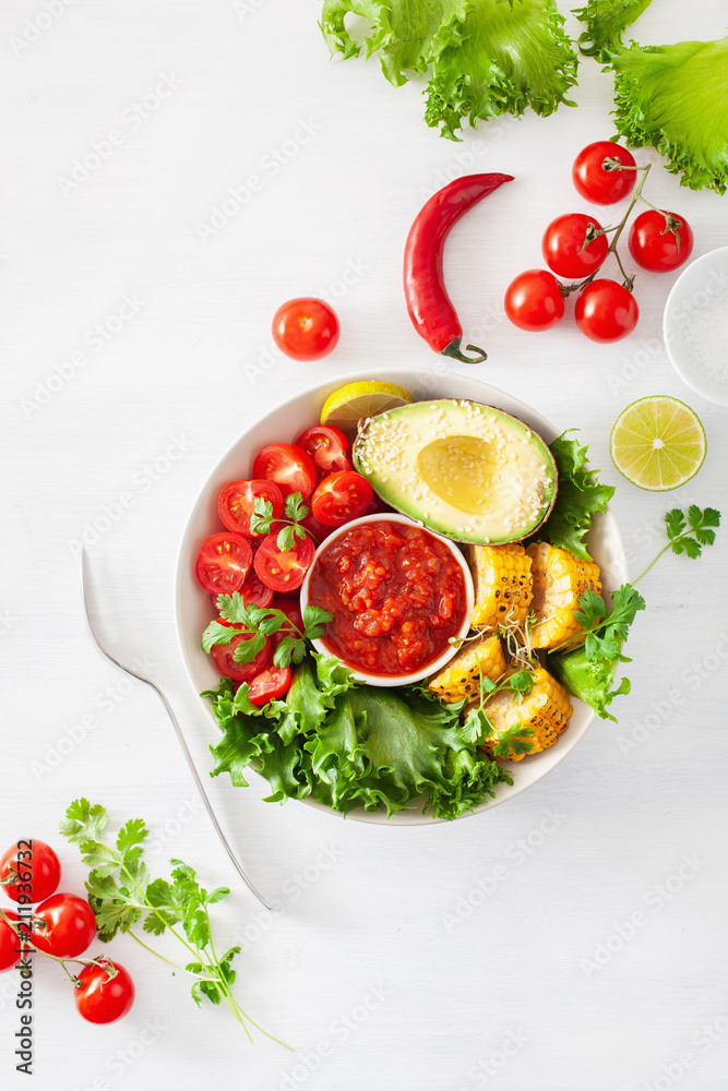 vegan buddha bowl. healthy lunch bowl with avocado, tomato, sweet corn and salsa vegan buddha bowl. healthy lunch bowl with avocado, tomato, sweet corn and salsa