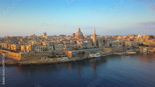 Valletta, Malta - 4K flying towards St.Paul's Cathedral and Our Lady of Mount Carmel Basilica at Valletta on a summer morning