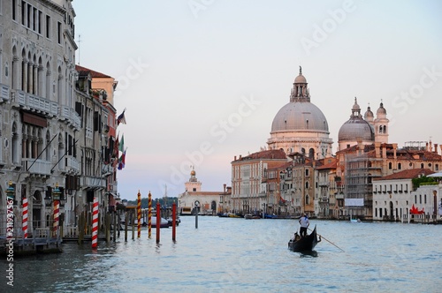 Night view of Gondolas on the Grand Canal and architectures in Venice, Italy
