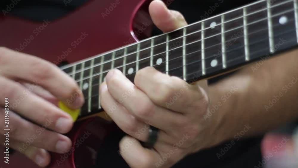 Close up caucasian male hands playing guitar Close up caucasian male hands playing guitar