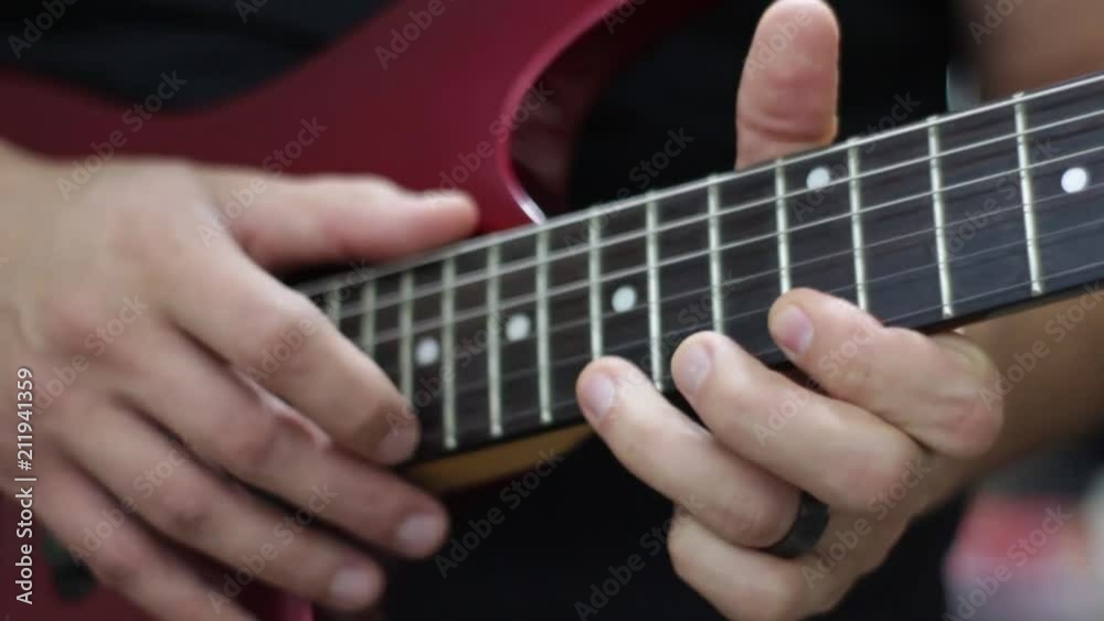 Close up caucasian male hands playing guitar Close up caucasian male hands playing guitar