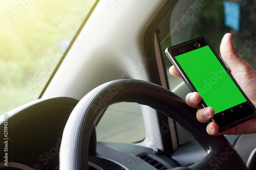 Use mobile phone in side car for Telephone or Navigator on screen green color. © thongchainak