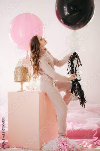 Photo of beautiful young woman with big balloons  photo