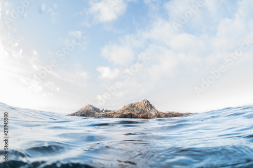 San Juanico island as seen from surface of ocean, Puerto Vallarta, Jalisco, Mexico photo