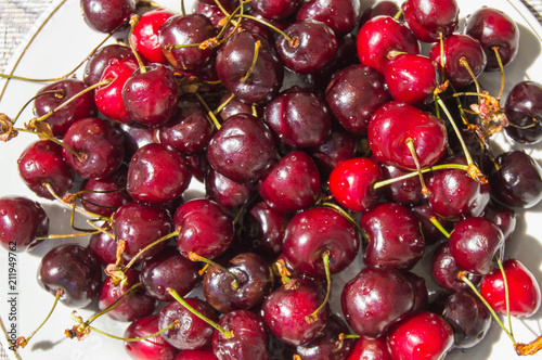 Fresh ripe cherry on a plate, top view photo