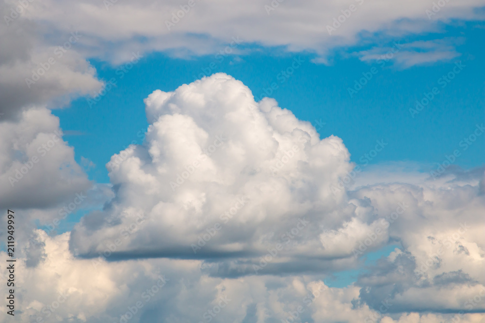 Scenic view at blue sky with clouds. Abstract nature background. Dramatic sky with fluffy clouds. Sunny day. Scenic view at blue sky with clouds. Abstract nature background. Dramatic sky with fluffy clouds. Sunny day.