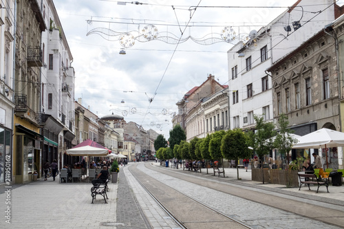 Canvas Print The railroad of public transport - modern tram - and the car roads cross the ped