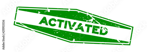 Grunge green activated wording hexagon rubber seal stamp on white background