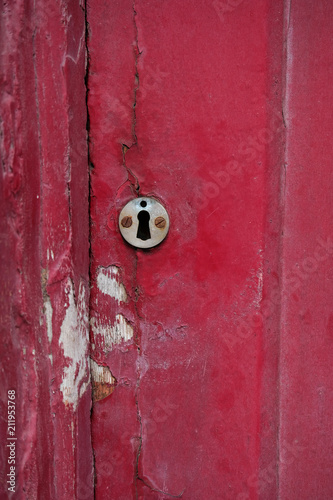 Old door with lock in poor condition.