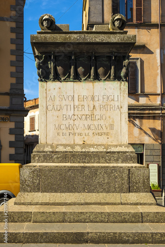 Bagnoregio, Italy - Historic center of Bagnoregio old town quarter with War Memorial at Piazza Cavour square