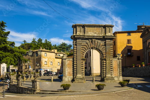 Bagnoregio, Italy - Ancient Roman gate arch in historic center of old town quarter at Piazza di Porta Albana square