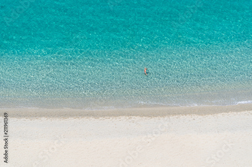 Beautiful empty sandy beach and turquoise sea from above