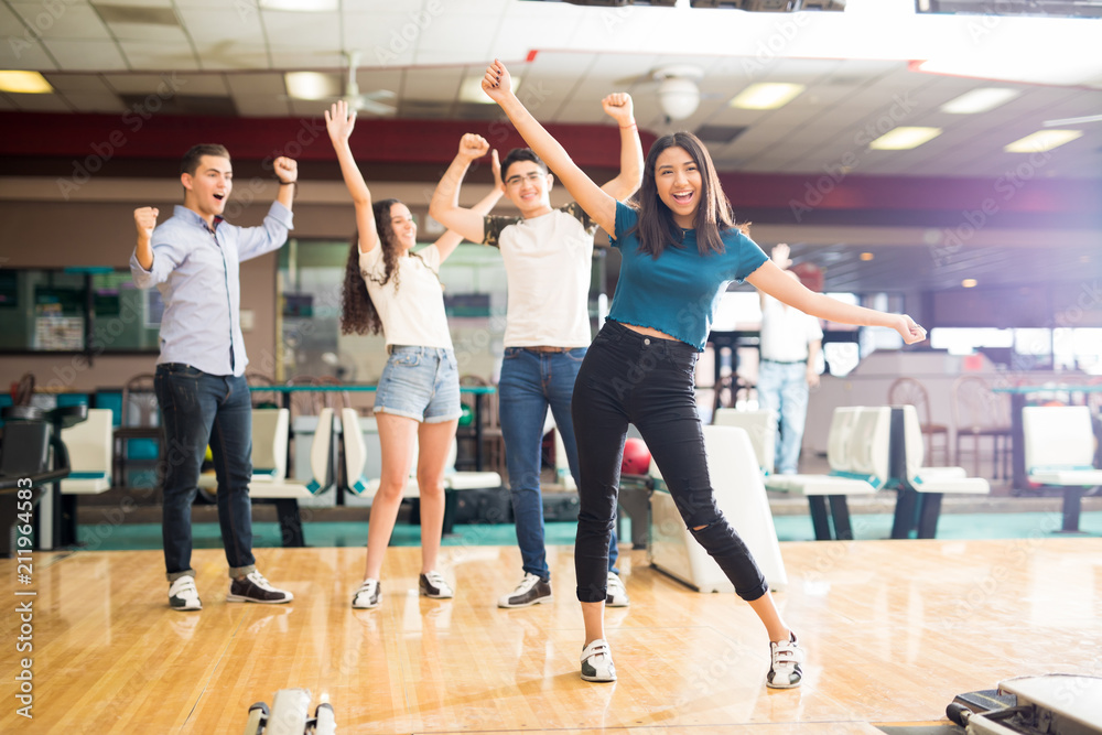 Naklejka premium Friends Enjoying Victory At Bowling Club