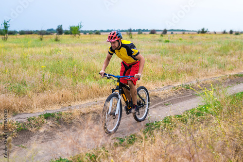 Cyclist riding a bike, cycling.