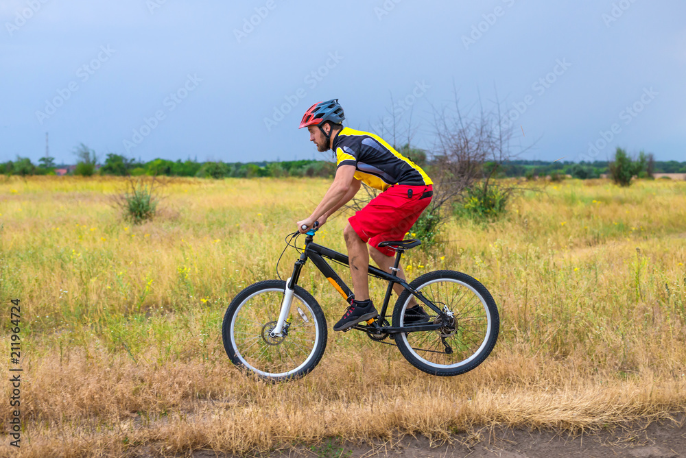 Cyclist riding a bike, cycling.