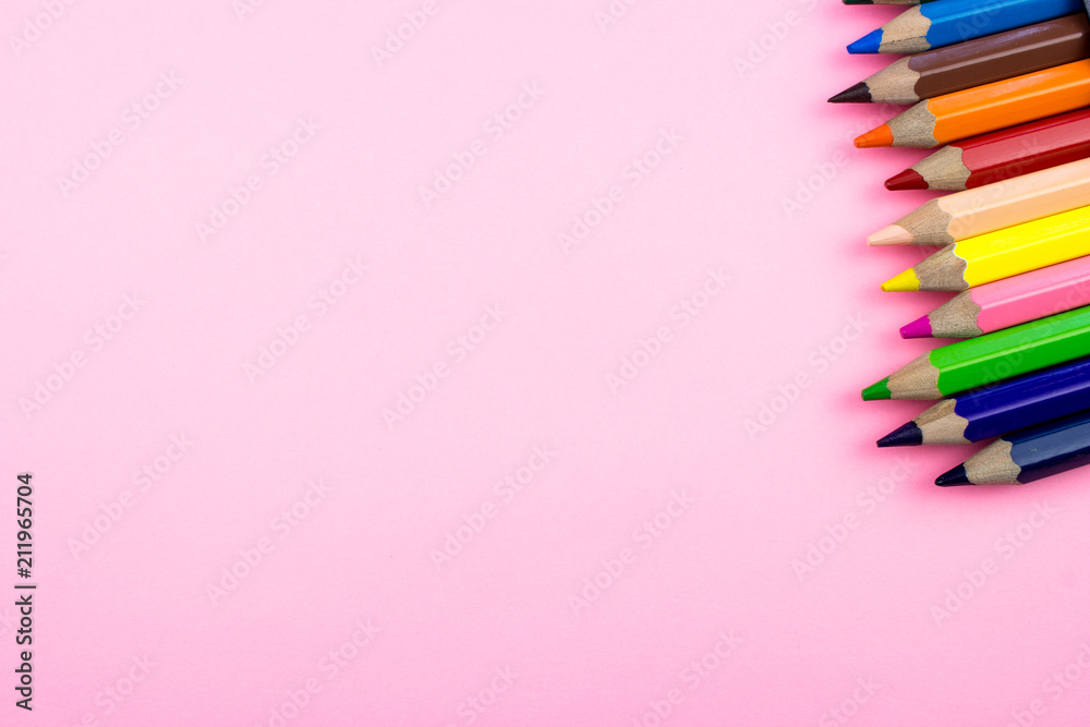 Pencils set on rose tone color paper. Empty space for text and design. Minimalism concept. Pencils set on rose tone color paper. Empty space for text and design. Minimalism concept.