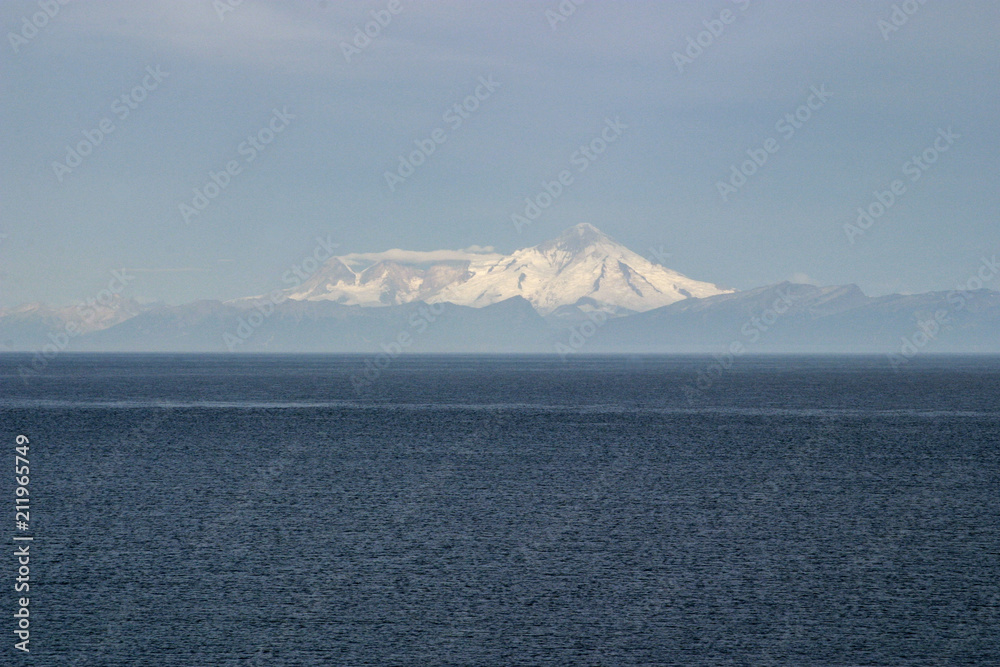 Ocean and Snow Capped Mountain on Sunny Day