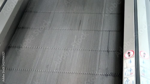 Passengers on moving walkway at the airport