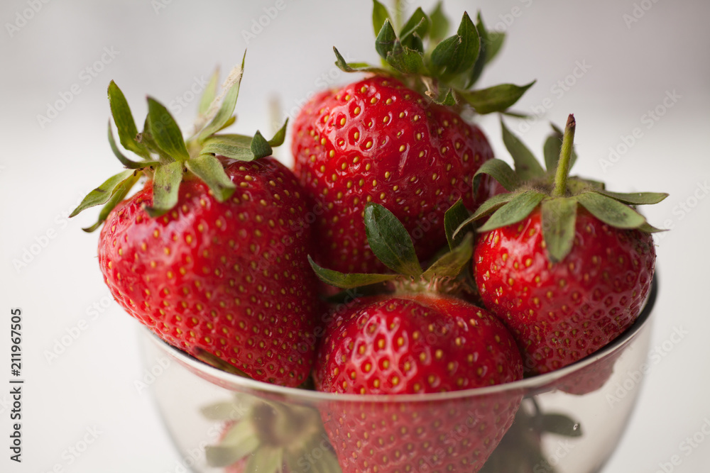 Strawberry in bow on white table. Strawberries top view. Beautiful strawberries. Strawberry in bow on white table. Strawberries top view. Beautiful strawberries.