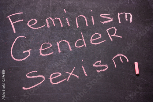 The word gender, feminism, sexism is written chalk