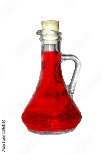A glass flask with a red substance over a white background.