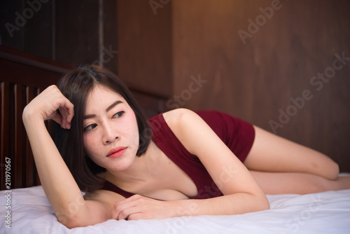 Portrait of beautiful asian sexy woman in the bedroom,Thailand people,Pose for take a picture,