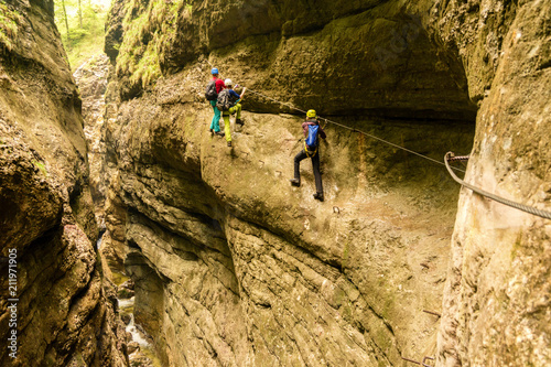 Climbing adventure in deep canyon of Postalmklamm via ferrata, Austria