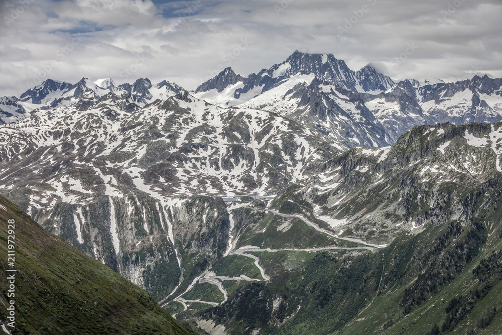 Furka Pass and Grimsel Pass in the swiss alps in early summer with still snow on the mountains Furka Pass and Grimsel Pass in the swiss alps in early summer with still snow on the mountains