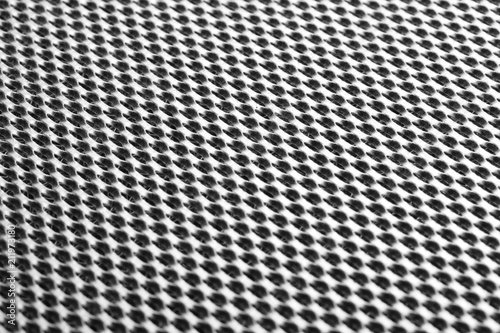 Metal grid close-up. Monochrome image. Abstract industrial background